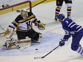 Kingston Frontenacs goalie Lucas Peressini makes a save on Mississauga Steelheads’ Jared Walsh during Ontario Hockey League action at the Rogers K-Rock Centre on Oct. 9. (Ian MacAlpine/The Whig-Standard)