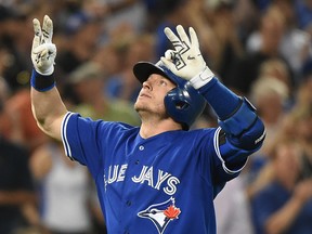 Toronto Blue Jays third baseman Josh Donaldson (20) celebrates as he crosses home plate after hitting a home run against Miami Marlins in the seventh inning at Rogers Centre June 10, 2015. (Dan Hamilton-USA TODAY Sports)