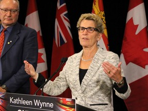 Premier Kathleen Wynne addresses the media on Thursday, October 15 2015. (Antonella Artuso/Toronto Sun)