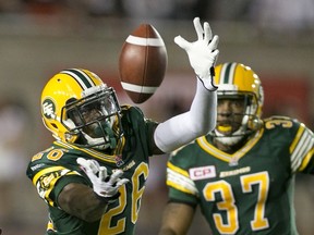 Eskimos cornerback John Ojo makes an interception against the Alouettes in Montreal in August. (Reuters)