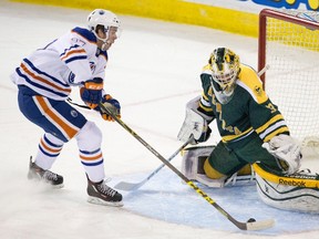U of A Golden Bearsgoalie Luke Siemens makes a stop on Connor McDavid during the annual preseason game between the university team and the Oilers rookies in September. (The Canadian Press)