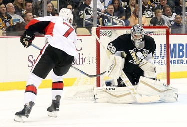 Oct 15, 2015; Pittsburgh, PA, USA; Pittsburgh Penguins goalie Marc-Andre Fleury (29) makes a save against Ottawa Senators center Kyle Turris (7) during the first period at the CONSOL Energy Center. Mandatory Credit: Charles LeClaire-USA TODAY Sports