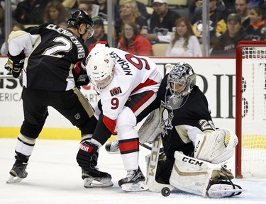 PITTSBURGH, PA - OCTOBER 15: Marc-Andre Fleury #29 of the Pittsburgh Penguins makes a save behind Milan Michalek #9 of the Ottawa Senators during the game at Consol Energy Center on October 15, 2015 in Pittsburgh, Pennsylvania.   Justin K. Aller/Getty Images/AFP
== FOR NEWSPAPERS, INTERNET, TELCOS & TELEVISION USE ONLY ==