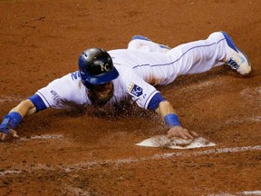 Royals' Alex Gordon slides home safely during Game 7 of the 2014 World Series against the Giants in Kansas City. (Doug Pensinger/Getty Images/AFP)