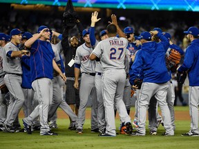 The Mets celebrate their 3-2 victory against the Dodgers following Game 5 of the NL Division Series in Los Angeles on Thursday, Oct. 15, 2015. (Richard Mackson/USA TODAY Sport)