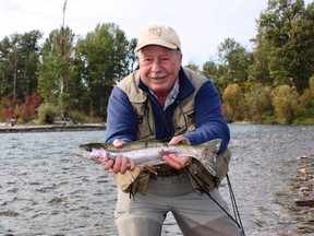 Neil Waugh with a jacked up Adams River rainbow