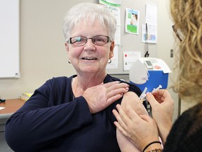 ackie Longley receives her flu shot Friday at the first Lambton Public Health clinic of the season. A total of 10 community clinics are planned in Sarnia-Lambton in October and November. (Tyler Kula/Sarnia Observer/Postmedia Network)