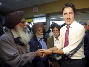 Liberal leader Justin Trudeau greets supporters during a campaign stop in Brampton, Ontario, October 16, 2015. (REUTERS/Chris Wattie)