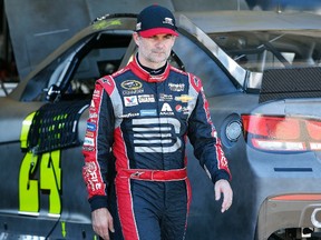 Jeff Gordon walks back to his trailer during a morning NASCAR Sprint Cup race teams testing practice session at Phoenix International Raceway Wednesday, Oct. 14, 2015, in Avondale, Ariz. (AP/Ross D. Franklin)