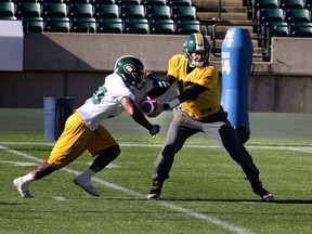 Eskimos quarterback Mike Reilly, shown here at practice this week with RB Shakir Bell, says the team won't by coming up with any crazy new schemes. (Perry Mah, Edmonton Sun)