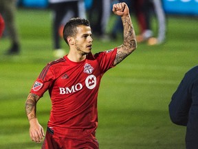 Toronto FC's Sebastian Giovinco celebrates a win against the New York Red Bulls during MLS action in Toronto on Wednesday October 14, 2015. Toronto FC has qualified for the Major League Soccer playoffs for the first time in the team's nine-year history after beating the visiting New York Red Bulls 2-1. (THE CANADIAN PRESS/Aaron Vincent Elkaim)
