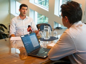 Edmonton Mayor Don Iveson (left) speaks during a half of term interview with the Edmonton Sun's Dave Lazzarino (right) at City Hall in Edmonton, Alta., on Friday October 16, 2015. Ian Kucerak/Edmonton Sun/Postmedia Network