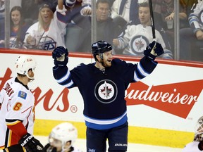 Jets centre Bryan Little celebrates his second-period goal that tied the game at 1-1.