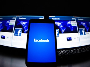 The loading screen of the Facebook application on a mobile phone is seen in this photo illustration taken in Lavigny May 16, 2012.  REUTERS/Valentin Flauraud/Files
