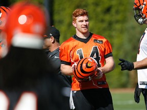 Cincinnati Bengals quarterback Andy Dalton attends practice outside Paul Brown Stadium in Cincinnati on Oct. 15, 2015. (AP Photo/John Minchillo)