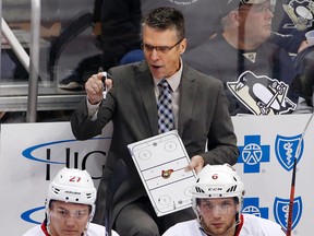 Ottawa Senators head coach Dave Cameron gives instructions during the first period of an NHL hockey game against the Pittsburgh Penguins in Pittsburgh Thursday, Oct. 15, 2015. The Penguins won 2-0. (AP Photo/Gene J. Puskar)