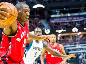 Toronto Raptors centre Bismack Biyombo reaches to try and keep the ball in play in a pre-season matchup against the Minnesota Timberwolves at the Canadian Tire Centre in Ottawa on Oct. 14, 2015. (Marc DesRosiers/USA TODAY Sports)