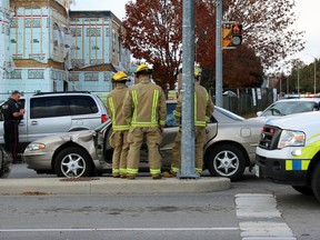 Emergency services responded to the intersection of Johnson Street and Sir John A. Macdonald Boulevard  in Kingston, Ont. on Saturday October 17, 2015 where two vehicles were involved in a collision. The driver of a car was extricated by Kingston Fire and Rescue and taken to hospital by Frontenac Paramedic Services as a precaution. Steph Crosier/Kingston Whig-Standard/Postmedia Network