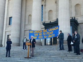 Premier Greg Selinger "says yes to unity" on the steps of the Manitoba Legislative Building, Oct. 17, 2015.