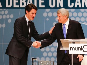 Conservative Leader Stephen Harper, right, and Liberal Leader Justin Trudeau shakes hands after participating in the Munk Debate on Canada's foreign policy in Toronto, on Monday, Sept. 28, 2015. THE CANADIAN PRESS/POOL-Mark Blinch