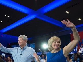 Conservative Leader Stephen Harper and wife, Laureen, wave to the crowd during a campaign rally in Toronto on Saturday, Oct. 17, 2015. THE CANADIAN PRESS/Jonathan Hayward