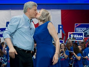 Conservative Leader Stephen Harper receives a kiss from wife Laureen at a campaign rally in Toronto on Saturday, Oct. 17, 2015. Canadians will go to the polls in the Federal election Oct. 19. THE CANADIAN PRESS/Jonathan Hayward