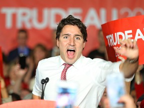 Liberal Leader Justin Trudeau greets supporters upon arriving at the podium during a rally at St. James Civic Centre in Winnipeg on Sat., Oct. 17, 2015. (Kevin King/Winnipeg Sun)