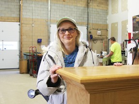 Point Edward Casino manager Nora Jennings checks the fireplace frame she unloaded when casino workers were helping out at the Habitat for Humanity ReStore facility in Sarnia on Saturday. NEIL BOWEN/ SARNIA OBSERVER/ POSTMEDIA NETWORK