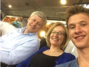 Prime Minister Stephen Harper, his wife Laureen and their son Ben, now 19, smile while attending a recent Toronto Blue Jays game. This is the first general election in which Ben is eligible to vote and, on Sunday October 18, 2015, he urged supporters to vote for his dad (CONSERVATIVE PARTY OF CANADA)
