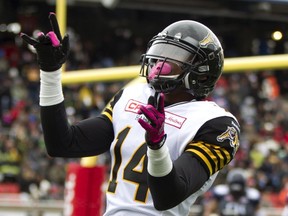 Hamilton Tiger-Cats' Terrell Sinkfield Jr. reacts following his touchdown in the first half against the Alouettes in Montreal on Sunday. (Christinne Muschi/Reuters)