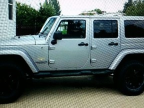 The Edmonton Police Service is asking for the public’s help to locate a stolen silver Jeep Wrangler allegedly involved in a hit and run collision that occurred in northeast Edmonton this morning. Officers responded to the area of Henry Avenue (near Hermitage Road) at approximately 6 a.m. on Sunday, Oct. 18, 2015. It is reported an adult male was making door-to-door deliveries in the area of Henry Avenue this morning. The man left his mid-size car running as he went to make a delivery and the vehicle was approached by a silver Jeep Wranger carrying four males. A youth male allegedly exited the Jeep and entered the mid-size car. Police believe the youth was attempting to steal the vehicle. The adult male returned to the vehicle and a short physical altercation occurred with the youth male. It is reported the Jeep Wrangler then attempted to flee the scene, striking the adult male, the youth male and the mid-size car in the process. Both males sustained non-life threatening injuries and were treated and transported to hospital. Police are searching for the stolen 2013 silver Jeep Wrangler involved in the hit and run collision.