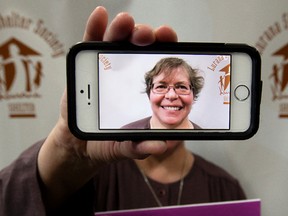 Sister Lucinda Patterson poses for a photo as she promotes the 'Support the End of Violence ... One Selfie At A Time' campaign, at the Lurana Shelter Society booth during the Edmonton Women's Show, at the Edmonton Expo Centre, in Edmonton Alta. on Sunday Oct. 18, 2015. David Bloom/Edmonton Sun/Postmedia Network
