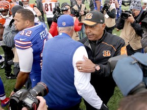 Head coach Rex Ryan of the Buffalo Bills and head coach Marvin Lewis of the Cincinnati Bengals congratulate each other at Ralph Wilson Stadium in Orchard Park, N.Y., on Oct. 18, 2015. (Brett Carlsen/Getty Images/AFP)