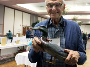 Dr. Jim Stewart, an avid decoy collector who recently donated 150 Prince Edward County and Thousand Islands decoys to the Canadian Museum of History, at the the 2015 Decoy and Outdoor Collectibles Show in Kingston, Ont. on Saturday. (Steph Crosier/The Whig-Standard)