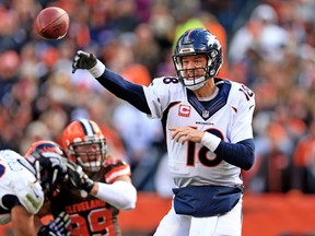 Quarterback Peyton Manning of the Denver Broncos throws a pass during the fourth quarter against the Cleveland Browns at Cleveland Browns Stadium on Oct. 18, 2015. (Andrew Weber/Getty Images/AFP)