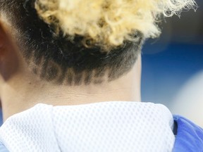 Jays’ Game 3 starting pitcher Marcus Stroman has HDMH shaved into the back of his head. The intitals stand for ‘height doesn’t measure heart.’ (Stan Behal/Toronto Sun)