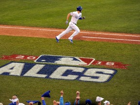 Eric Hosmer of the Kansas City Royals runs the bases after hitting an RBI single in the seventh inning against the Toronto Blue Jays in Game 2 of the American League Championship Series at Kauffman Stadium in Kansas City on Oct. 17, 2015. (Ed Zurga/Getty Images/AFP)