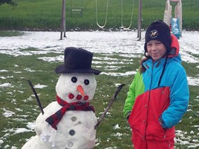 Mike McCarthy, of just outside Mitchell, sent us this photo of his daughter Margaret standing beside a snowman she built during the early snowfall which fell last Saturday/Sunday – Oct. 18. SUBMITTED
