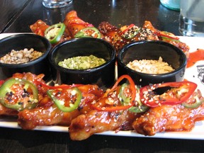 A platter of the sweet and spicy General's Wings, a favourite dish at Guy Fieri's Vegas Kitchen & Bar. JANE STEVENSON/TORONTO SUN