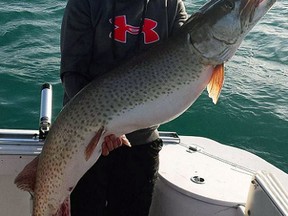 Christine Cope holds trophy muskie she landed with fishing partner Darryl Crossett, St. Thomas, on Saturday on Lake St. Clair.