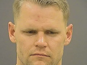 Anne Arundel County police officer Michael Flaig is pictured in this undated handout photo courtesy of the Baltimore Police Department. Flaig, a Maryland police officer who bit a man's testicles during an off-duty fight outside a Baltimore bar and has been charged with assault, according to court documents made public on May 6, 2015.  REUTERS/Baltimore Police Department/Handout