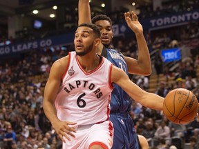 Toronto Raptors' Cory Joseph lays off a pass despite pressure from Minnesota Timberwolves' Karl-Anthony Towns during first half NBA pre-season basketball action in Toronto on Monday, October 12, 2015. (THE CANADIAN PRESS/Chris Young)