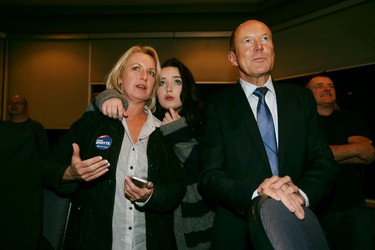 PC candidate Kerry Diotte (r) with his partner Clare Denman (l) along with her daughter Mikayla watch as results start rolling in at Highlands Golf Course in Edmonton, Alberta on October 19, 2015. Perry Mah/Edmonton Sun/Postmedia Network