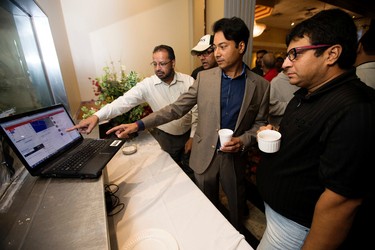 Supporters of Edmonton - Mill Woods Liberal candidate Amarjeet Sohi, watch election results on a computer at the Maharaja Banquet Hall, 9257 - 34A Ave., in Edmonton Alta. on Monday Oct. 18, 2015. David Bloom/Edmonton Sun/Postmedia Network