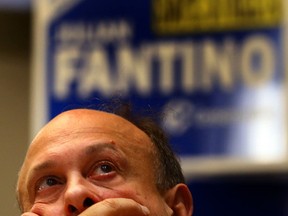 A supporter of Conservative candidate Julian Fantino watches as the results come in at Fontana Primavera Event Centre on Oct.19, 2015. (Dave Abel/Toronto Sun)
