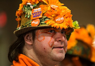 New Democrat Party supporter Richard Kennedy dresses up at the Edmonton federal NDP headquarters at the Sutton Place Hotel in Edmonton, Alta., on Monday, Oct. 19, 2015. Codie McLachlan/Edmonton Sun/Postmedia Network