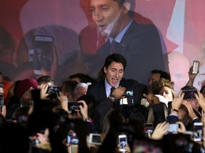 Liberal Party leader Justin Trudeau is greeted by supporters as he arrives to give his victory speech after Canada's federal election in Montreal, October 19, 2015. (REUTERS/Chris Wattie)