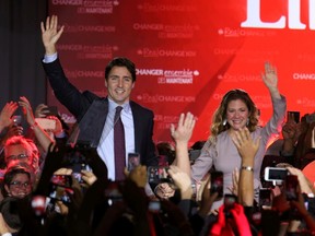 Liberal Party leader Justin Trudeau waves while accompanied by his wife Sophie Gregoire as he arrives to give his victory speech after Canada's federal election in Montreal, Quebec, October 19, 2015. REUTERS/Chris Wattie