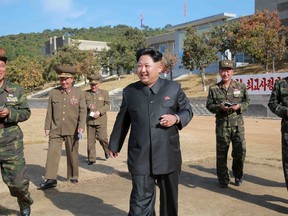 North Korean leader Kim Jong Un walks during an inspection of the Korean People's Army (KPA) Unit 350, in this undated photo released by North Korea's Korean Central News Agency (KCNA) in Pyongyang on October 16, 2015. REUTERS/KCNA