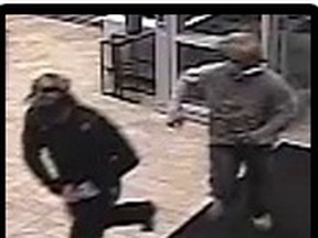 Ottawa police are seeking these two suspects in a furniture store robbery on the 1700 block of Heron Rd. on Sept. 30. (Submitted image Ottawa Sun / Postmedia Network)